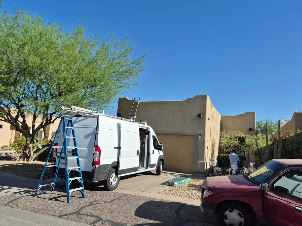 Our work van parked outside a client home for a painting project