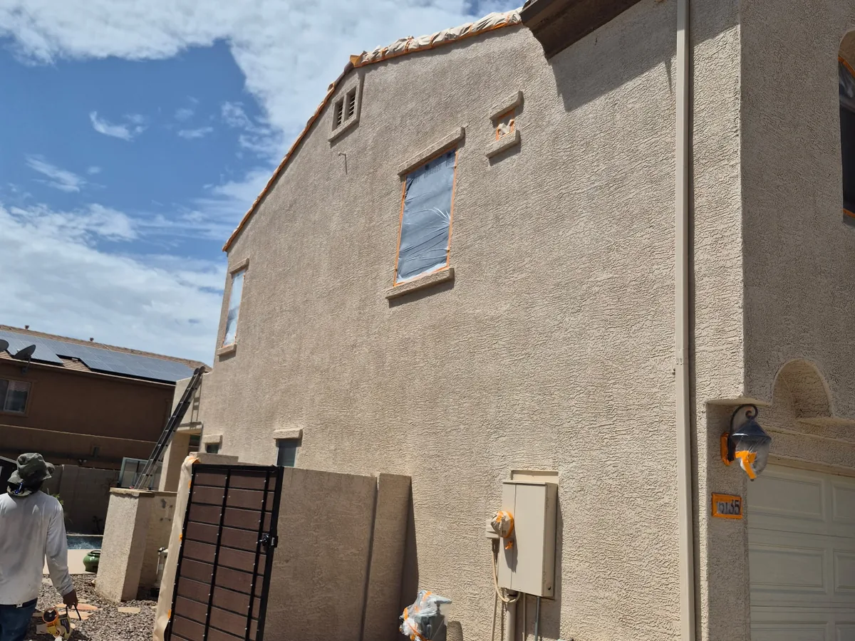 Close view of a freshly coated stucco exterior wall