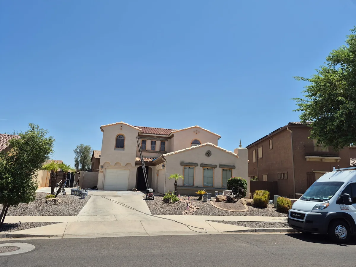 Two story stucco home painted